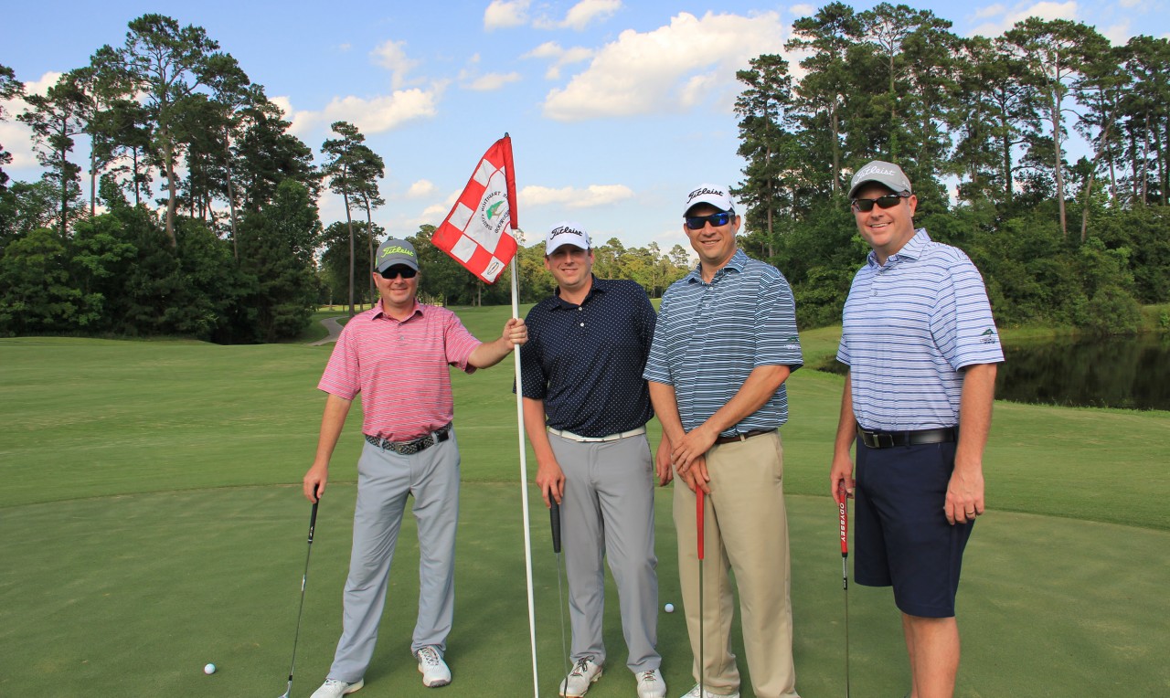 Foursome of golfers at the Bandit golf course near San Antonio, Texas